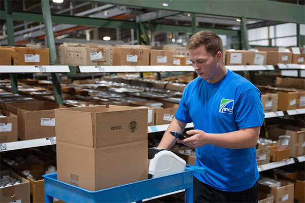 IPC warehouse employee gathering products for a member order