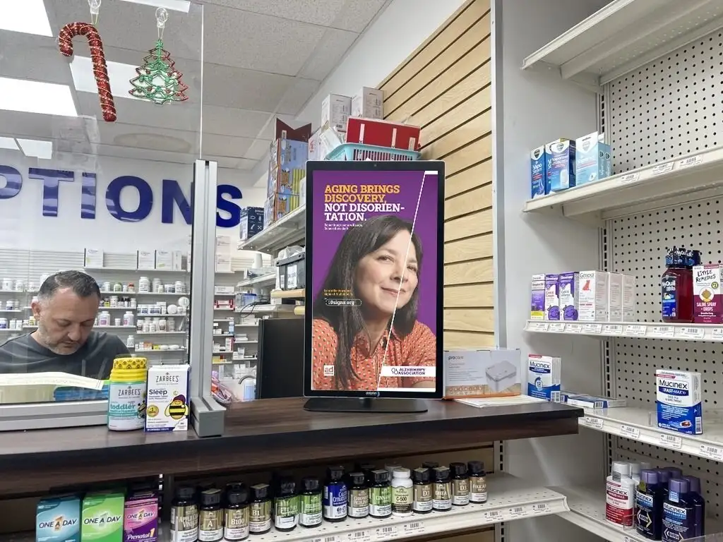 dolphin digital ooh screen displaying ad in pharmacy