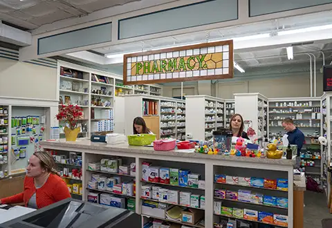 Pharmacist and pharmacy techs working in local independent pharmacy