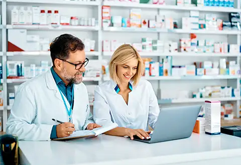 pharmacists looking over psao compliance-psao-compliance-category