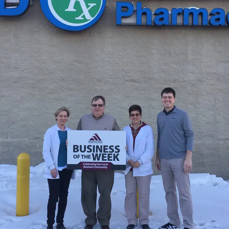 Bob Treitline and Staff in front of pharmacy